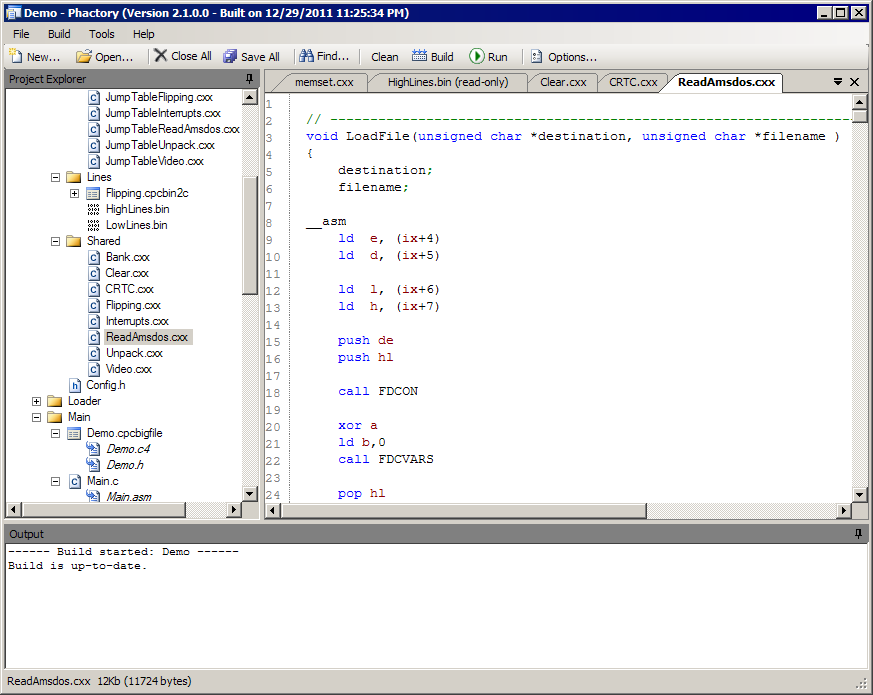 The source editor showing a C function with inline Z80 assembly, syntax coloured